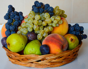 fresh fruit on wooden vase