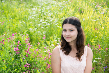 Naklejka na ściany i meble Portrait of Pretty teen girl outdoors in summer
