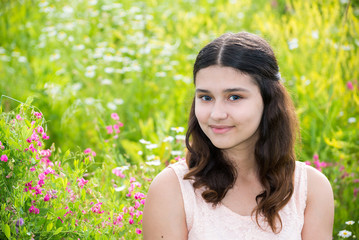 Naklejka na ściany i meble Portrait of Pretty teen girl outdoors in summer