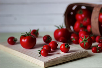fresh tomato for ketchup on wooden background