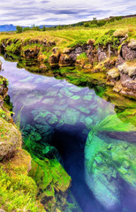 Water in a fissure between tectonic plates in the Thingvellir National Park, Iceland