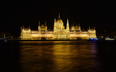 Budapest parliament at night near the Danube river
