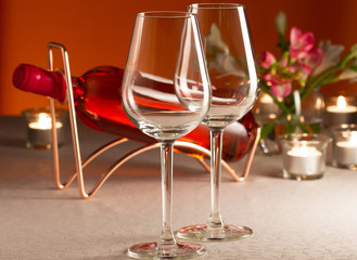 Two empty glass and bottle of rose wine