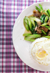 Kale with crispy pork on steamed rice