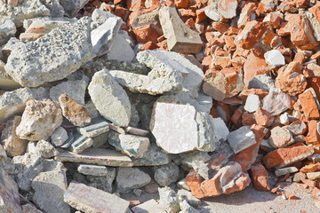 Concrete and brick rubble debris on construction site 