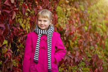 Girl having fun in autumn park