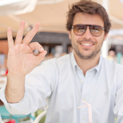 Young man all right gesture