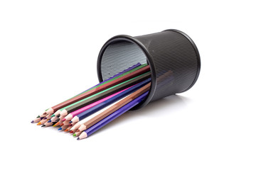 Colourful pencils coming out of black holder - artist concept