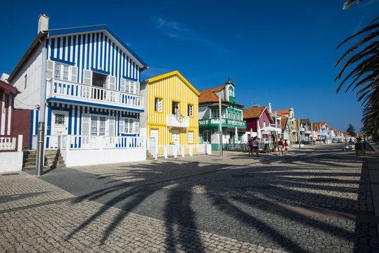 Colourful stripes decorate traditional beach house style on houses in Costa Nova, Portugal
