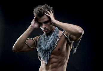attractive naked man with abdominal, chain mesh medieval neck wi - Powered by Adobe