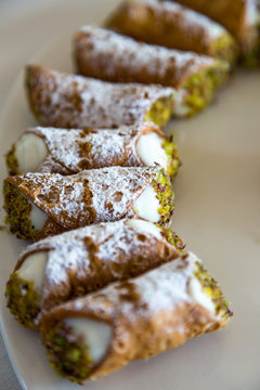 Traditional Sicilian Cannoli arranged on a plate, Sicily