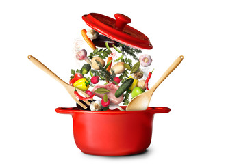 Big red pot for soup with vegetables - obrazy, fototapety, plakaty