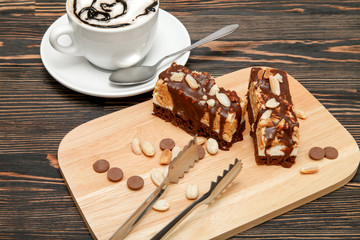 Chocolate hazelnut cake. Hot coffee with air foam