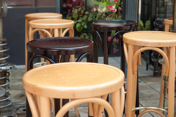 Empty tables and chairs on street cafe