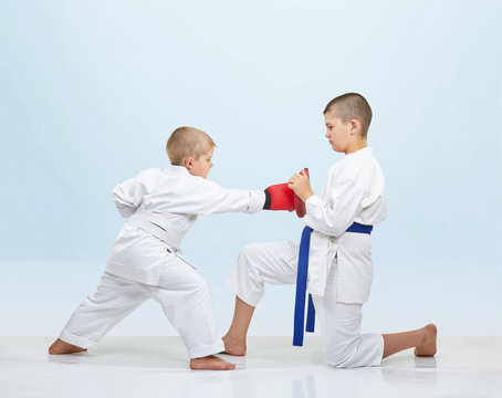 Boy karateka beats punch on fitness machine that brother keeps