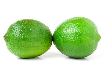 two lime isolated on white background close up