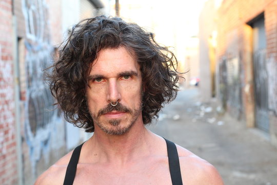 Close-up of man wearing black fetish leather outfit