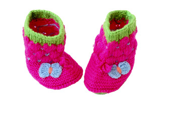 Baby booties shoes for newborn. Warm knitted shoes for babies isolated on a white background.The concept of heat.