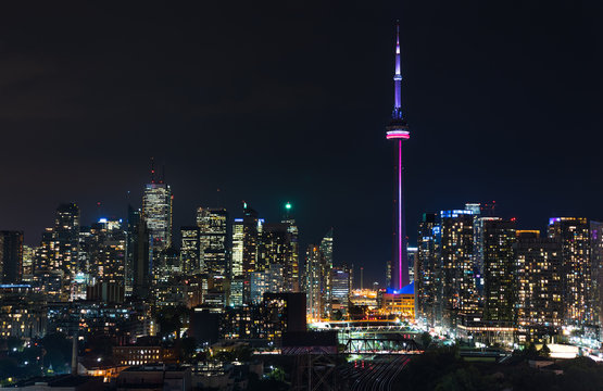 Urban lighted landscape of Toronto. A balcony view of lighted streets, parks, buildings and office towers on a hot & humid August night in capitol of Ontario, Canada. © valleyboi63