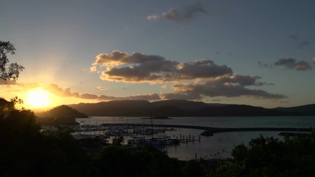 Sunset time lapse above Airlie beach town, Australia