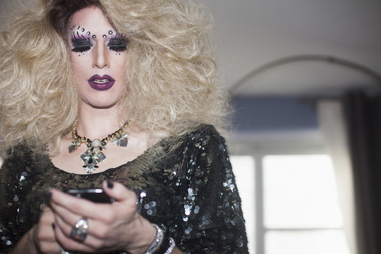 Drag queen using a cellphone