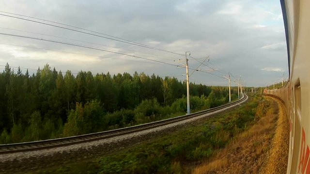 Trans-Siberian Railway trains driving in a sharp corner in the forest