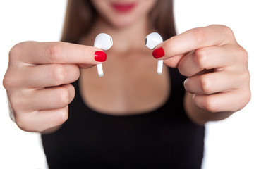 Young woman with wireless earphones
