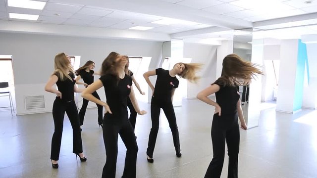 Young females are dancing in model school.