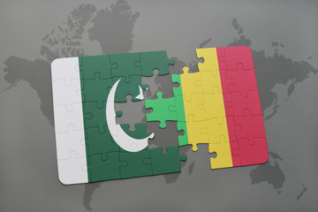 puzzle with the national flag of pakistan and mali on a world map background.