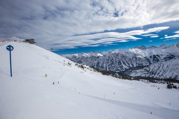 Obraz premium View to Ski slopes with the corduroy pattern and ski chairlifts on the top of Fellhorn Ski resort, Bavarian Alps, Oberstdorf, Germany