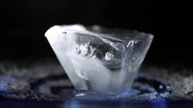 Twist ice cube dark background