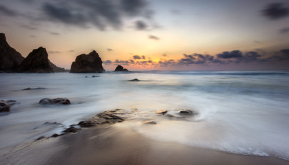 Warm sunset, isolated beach and a beautiful landscape sunset