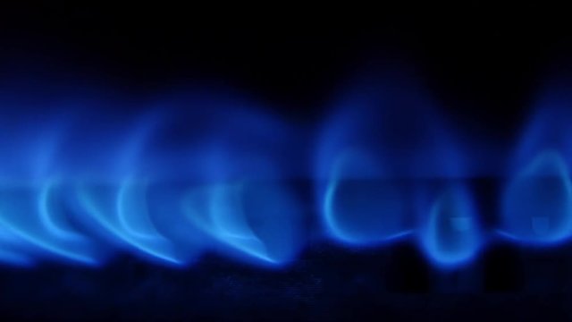 Turn on the gas burner with a blue flame. Close up