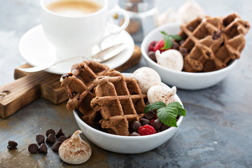 Chocolate waffles with meringues and coffee
