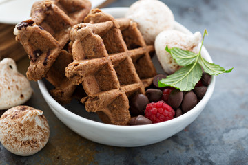 Chocolate waffles with meringues and coffee