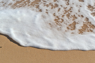 Beach summer sea waves detail in Algarve, Portugal