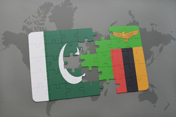 puzzle with the national flag of pakistan and zambia on a world map background.