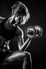 Tuinposter Fitness with dumbbells © Maksim Toome