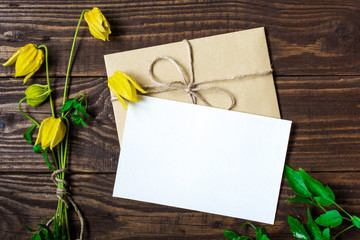 Blank white greeting card and envelope with yellow wildflowers