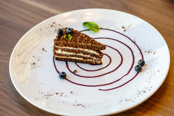 Coffee layer cake with blueberries and mint.