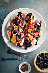 Watermelon pizza with fruits and yogurt
