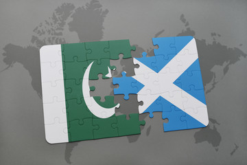 puzzle with the national flag of pakistan and scotland on a world map background.