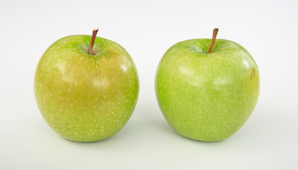 Green apples on white background