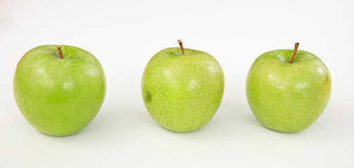 Green apples on white background