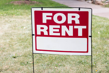 Blank For Rent sign on green yard
