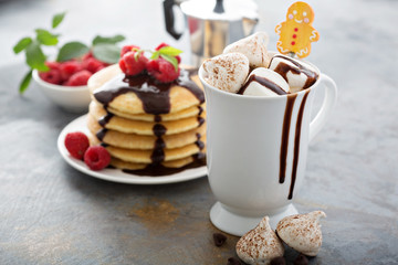 Hot chocolate with marshmallows and little meringues