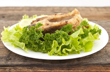 Roasted fish with fresh herbs and lemon. Selective focus