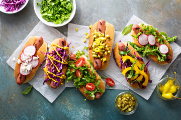 Variety of hot dogs with healthy garnishes - Powered by Adobe