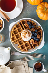 Pumpkin waffles with whipped cream for breakfast
