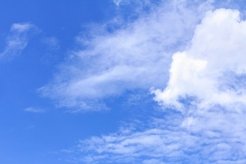Naklejka na ściany i meble Blue sky background with white clouds. The vast blue sky and clouds sky on sunny day. White fluffy clouds in the blue sky.